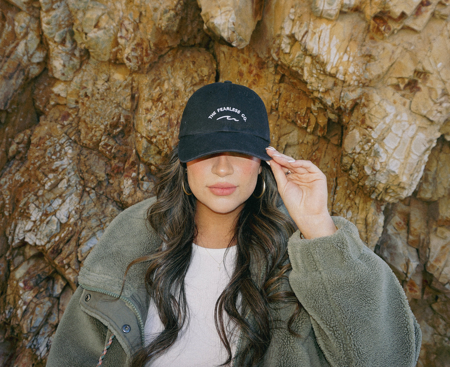 pre-washed unstructured dad hat in charcoal black. waves. the fearless co. 100% cotton.