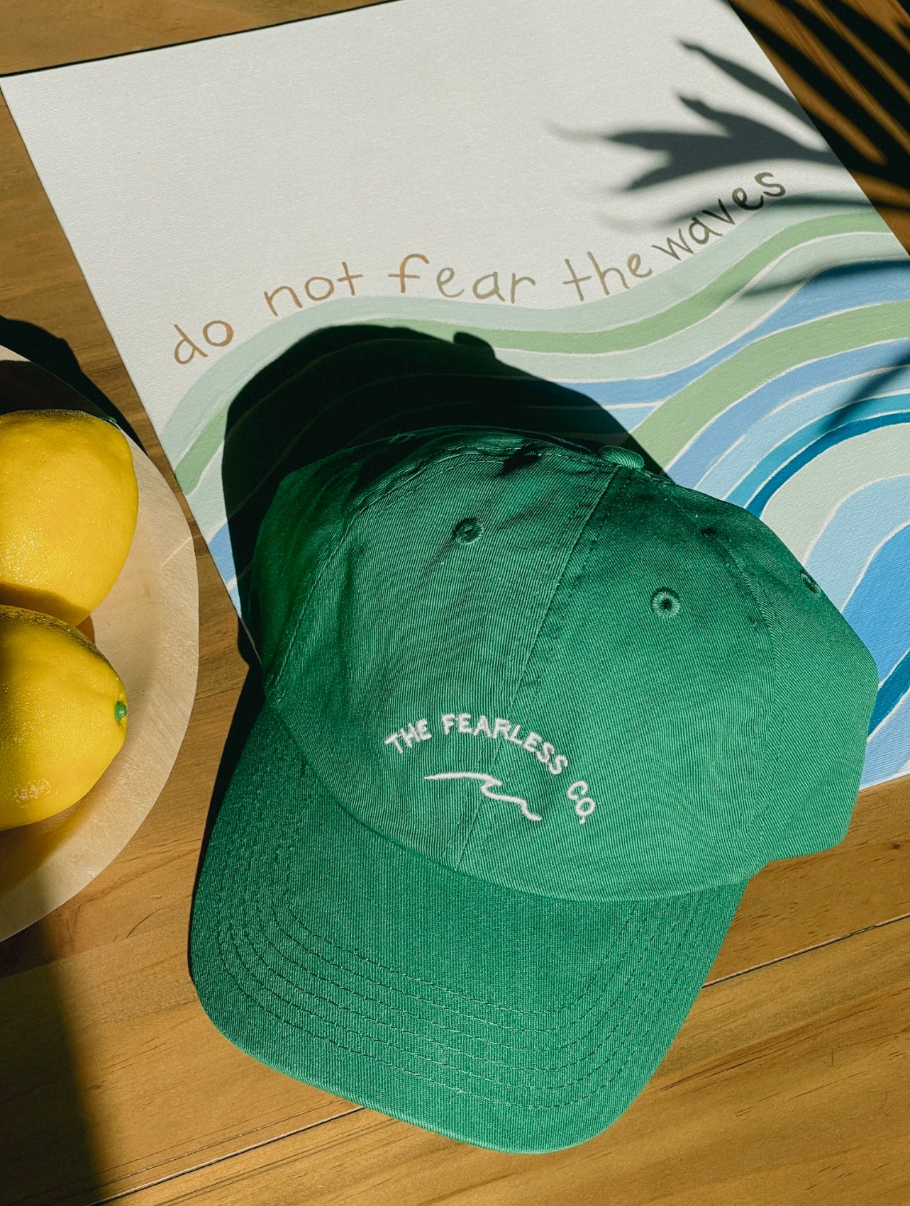 unstructured dad hat in the color kelly green. 100% cotton. Waves logo. waves. the fearless co.